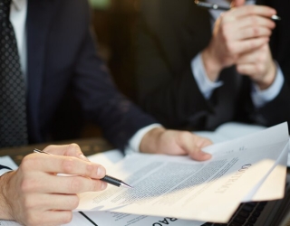 businessman-reading-contract_1098-14772