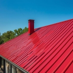 _ A modern villa with a sloped roof made of shiny red metal sheets, surroun_20250911_062226_۰۰۰۰